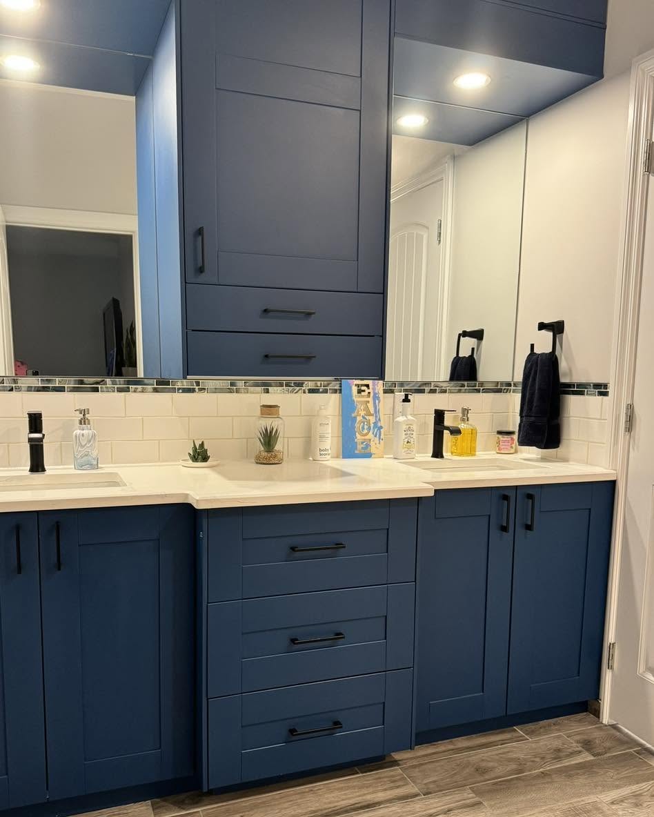 Bold blue custom vanity and tower cabinetry