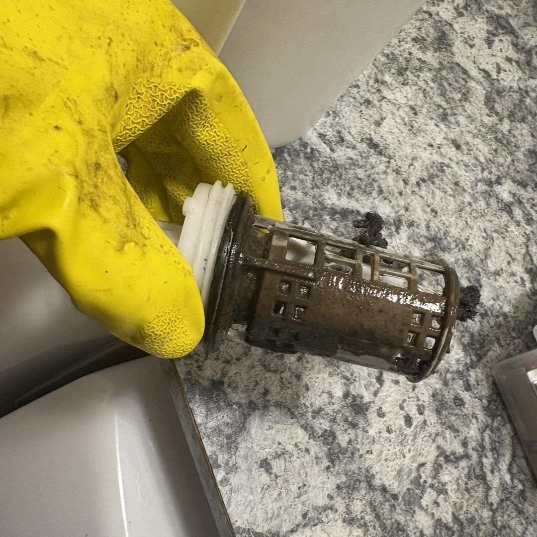 Sludge covered drain insert before detailing